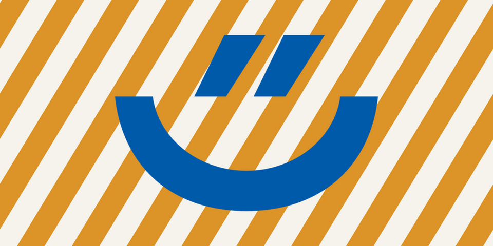 Blauer Smily auf orange, gestreiftem Hintergrund (Visual des Ehrentages)