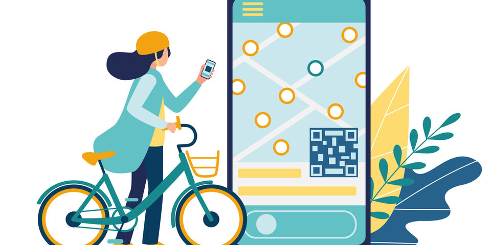 Frau mit Fahrrad gibt am Handy Daten für Bike-Sharing ein